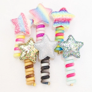 Star-shaped spiral hair ties for kids with glitter stars and colorful telephone wire cords