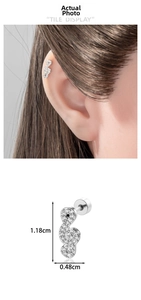 Macro detail of silver musical note ear stud with zirconia and threaded ball back