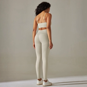 Detail view of seamless cream yoga set showing racerback bra and high waist leggings