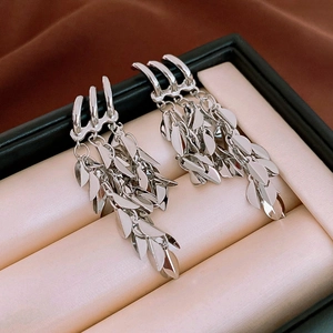 Macro shot of silver tiered tassel earrings displayed in a premium jewelry gift box