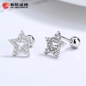 Macro shot of 925 sterling silver star stud earrings with pave-set cubic zirconia stones