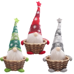Three Christmas gnome candy baskets in red, green and grey colors made of knitted fabric