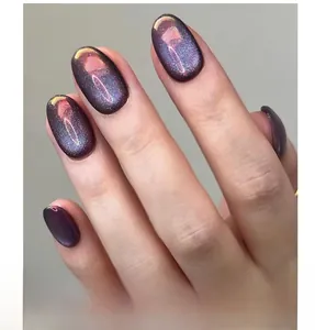 Macro detail of short round deep purple cat-eye press-on nails with starry galaxy effect