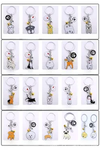 Detailkatalog mit 20 Zeichentrick-Hunde-Schlüsselanhängern, Goldglocken und Charms