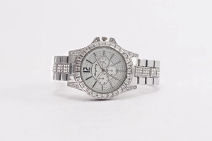 Macro shot of silver stainless steel watch with crystal-encrusted bezel and three sub-dials