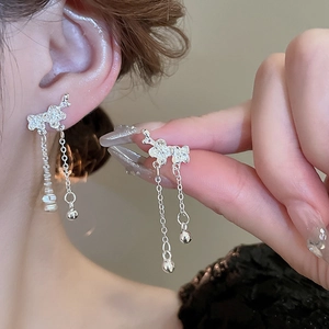 Elegant silver bow earrings with long tassel chains and small beads for women
