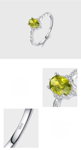 Macro shot of S925 sterling silver ring showing the olive green zircon prong setting