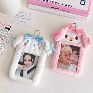 Detail of plush animal card holders in pink and white with cute bow decoration