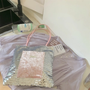 Detail of silver sequins and pink velvet pocket on a large capacity canvas tote bag