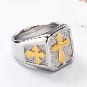 Detailed view of vintage cross ring with silver hammered texture and gold accents