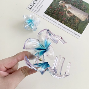 Floral frangipani hair claw clip set in gradient blue purple resin with silver glitter