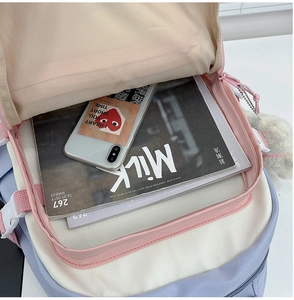 Top view of high-capacity pink and blue backpack showing internal storage and main compartment