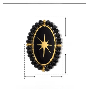 Macro view of vintage oval pendant showing size dimensions and star detail in stainless steel