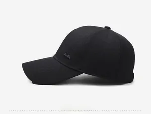 Side view of a classic black cotton baseball cap for men featuring a small fashion logo
