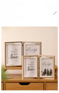 Detail of a rotating double-sided wooden photo frame in minimalist Nordic style