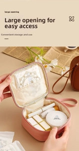 Detail of pink waterproof PU pouch showing wide opening and makeup storage compartments