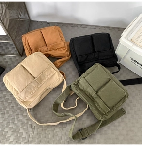 Canvas messenger bags in khaki, black, beige, and olive green with dual front pockets