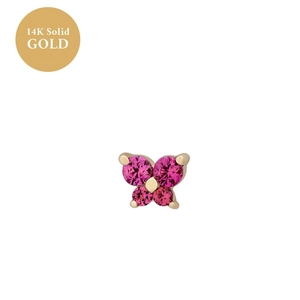 Detail of a 14K solid gold butterfly stud earring featuring pink sapphire gemstones