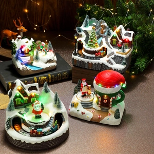 Illuminated Christmas resin music box with rotating train and festive LED miniature scene