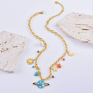 Golden necklace with celestial charms like sun, moon, stars, and purple planet pendant