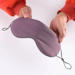 Elastic purple sleep mask with adjustable grey straps for light blocking and comfort