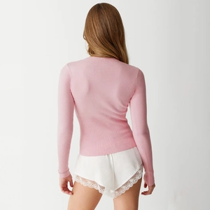 Slim fit pink long sleeve knit sweater with ribbed cuffs and hem, back view display