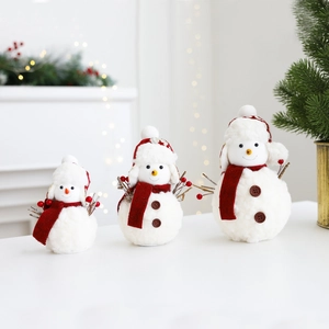 Three plush Christmas snowman figures in various sizes with festive red and white decorations