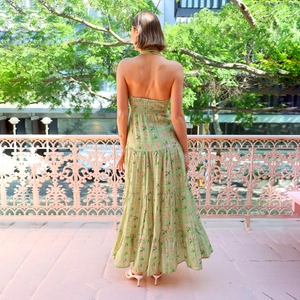 Floral halter backless maxi dress in green and pink with tiered A-line skirt