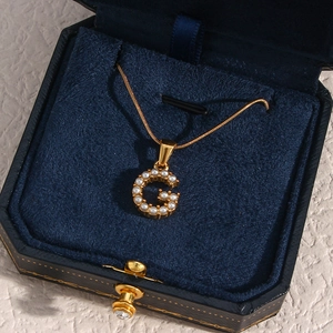 18K gold plated stainless steel letter G necklace with pearls in a luxury jewelry box