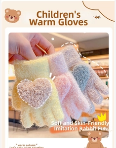Close-up of soft faux rabbit fur winter gloves for kids featuring a 3D heart design