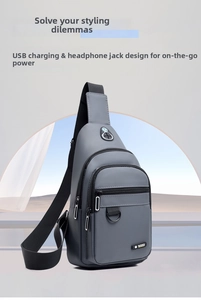 Detail of grey oxford chest bag featuring integrated USB charging port and headphone jack