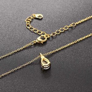Elegant gold pear-shaped pendant necklace with clear zircon stone and lobster clasp