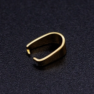 Macro shot of gold stainless steel U-shaped pendant clasp with polished mirror finish