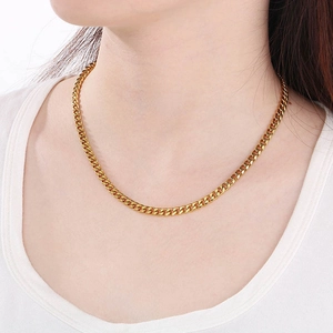 18K gold plated stainless steel Cuban chain necklace with square pendant on female model