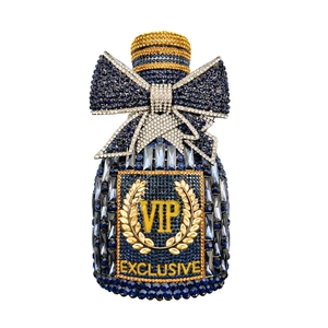 Detail of crystal encrusted perfume bottle clutch with blue rhinestone bow and VIP crest