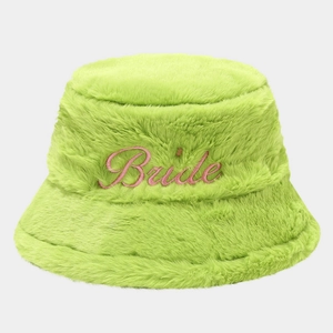 Detail of neon green plush bucket hat with pink embroidered Bride text for bachelorette parties