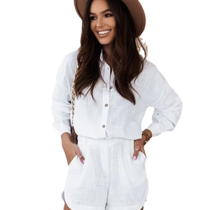 Women's summer white two-piece linen set featuring a long-sleeve shirt and casual shorts
