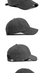 Detail view of winter baseball cap showing grey herringbone fabric and leather strap