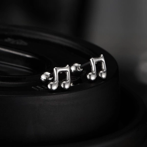 Minimalist eighth note stainless steel stud earrings with polished silver finish for music lovers