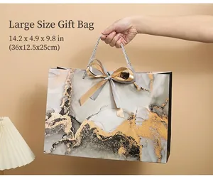 Large marble pattern gift bag with satin ribbon and dimensions 36x12.5x25cm