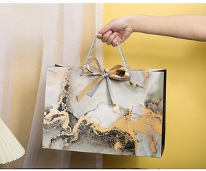 Large marble pattern gift bag with satin ribbon and dimensions 36x12.5x25cm