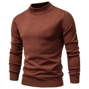 Detailed macro view of dark brick red men's ribbed knit sweater with semi-high collar
