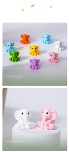 Close-up of small colorful resin elephant figurines for micro landscape decoration
