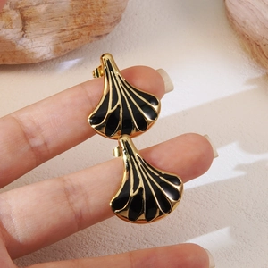 Vintage golden ginkgo leaf stud earrings with black enamel finish for women