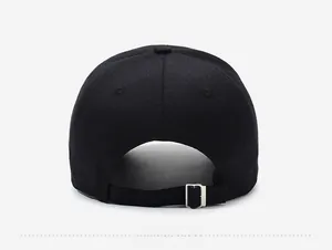 Close-up of black baseball cap back with adjustable silver metal buckle and opening