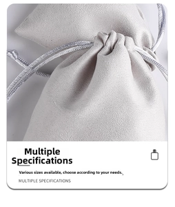 Close-up of light gray microfiber jewelry pouch showing soft texture and drawstring detail