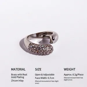Polished silver-tone open ring with asymmetric design and micro-pave cubic zirconia