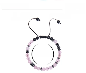 Detail of pink crystal beads and black matte stones with Morse code pattern on cord bracelet