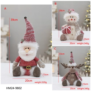 Detailed size and weight specifications for pink plush Santa, Snowman, and Reindeer dolls