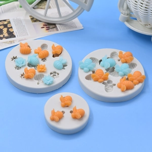 White silicone molds for bees and flowers with colorful wax resin finished crafts